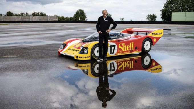 Hans-Joachim Stuck in front of his Porsche 962 C.